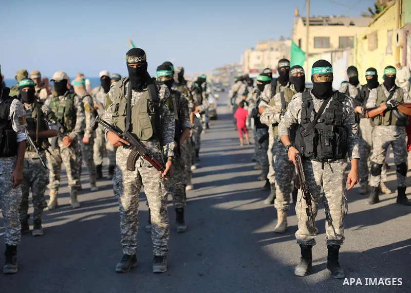 Palestinian militants of the Ezzedine al-Qassam Brigades, Hamas' armed wing, take part in a military parade to celebrate the Muslim festival of Eid al-Adha, in Gaza city, on Sep. 10, 2016. Photo by Mohammed Asad