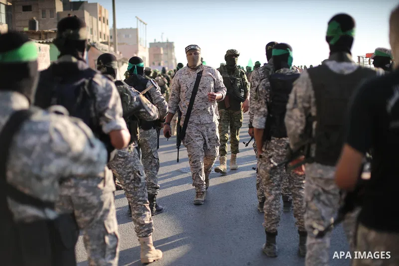Palestinian militants of the Ezzedine al-Qassam Brigades, Hamas' armed wing, take part in a military parade to celebrate the Muslim festival of Eid al-Adha, in Gaza city, on Sep. 10, 2016. Photo by Mohammed Asad