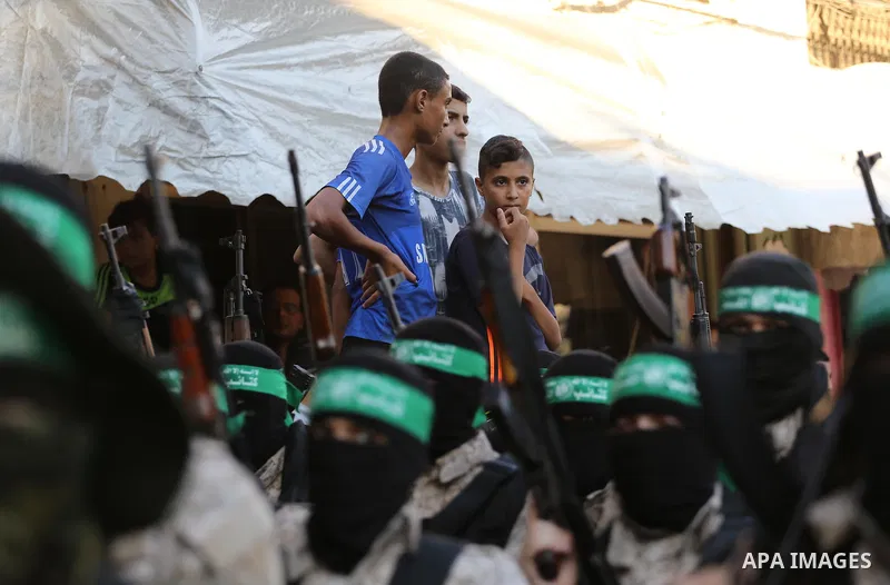 Palestinian militants of the Ezzedine al-Qassam Brigades, Hamas' armed wing, take part in a military parade to celebrate the Muslim festival of Eid al-Adha, in Gaza city, on Sep. 10, 2016. Photo by Mohammed Asad