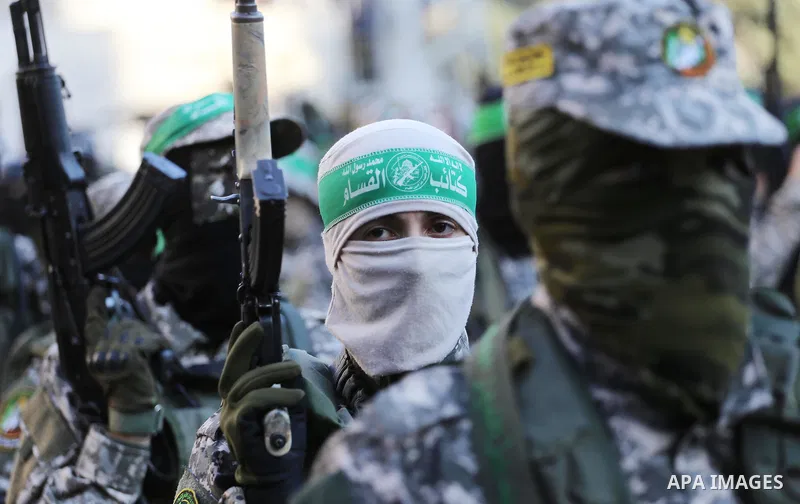 Palestinian militants of the Ezzedine al-Qassam Brigades, Hamas' armed wing, take part in a military parade to celebrate the Muslim festival of Eid al-Adha, in Gaza city, on Sep. 10, 2016. Photo by Mohammed Asad