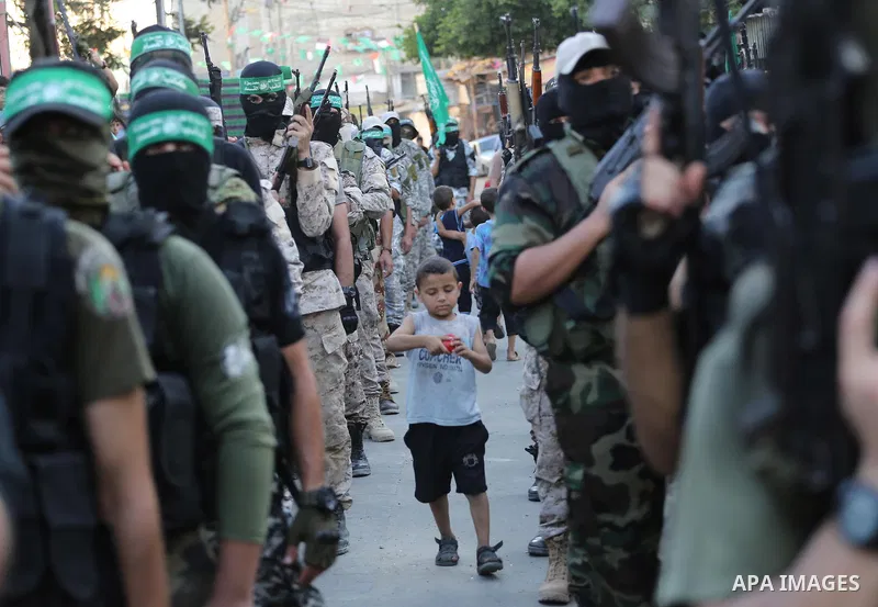 Palestinian militants of the Ezzedine al-Qassam Brigades, Hamas' armed wing, take part in a military parade to celebrate the Muslim festival of Eid al-Adha, in Gaza city, on Sep. 10, 2016. Photo by Mohammed Asad