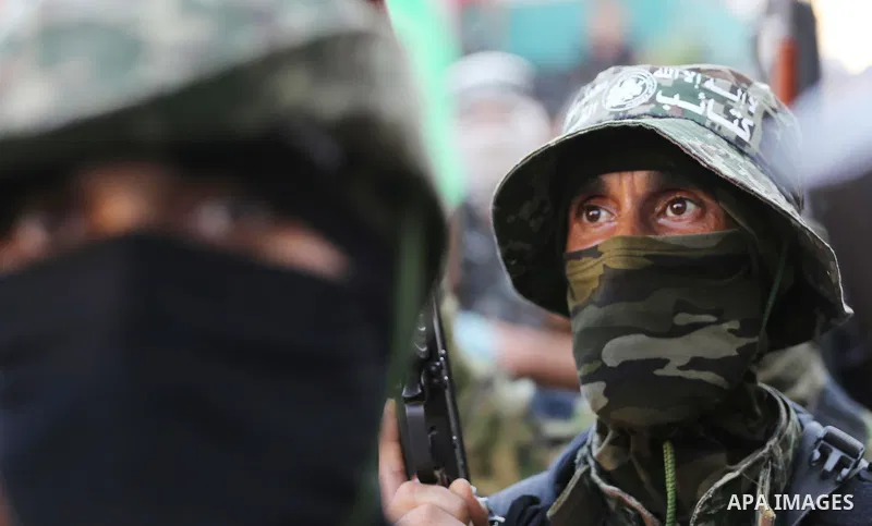 Palestinian militants of the Ezzedine al-Qassam Brigades, Hamas' armed wing, take part in a military parade to celebrate the Muslim festival of Eid al-Adha, in Gaza city, on Sep. 10, 2016. Photo by Mohammed Asad