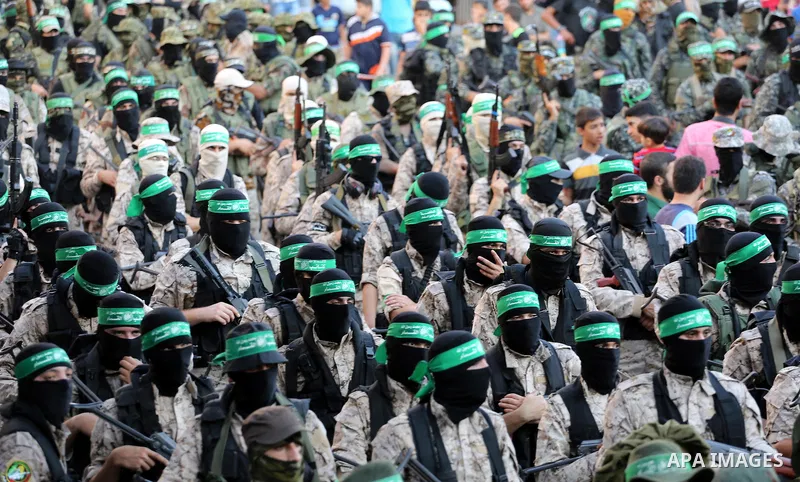 Palestinian militants of the Ezzedine al-Qassam Brigades, Hamas' armed wing, take part in a military parade to celebrate the Muslim festival of Eid al-Adha, in Gaza city, on Sep. 10, 2016. Photo by Mohammed Asad