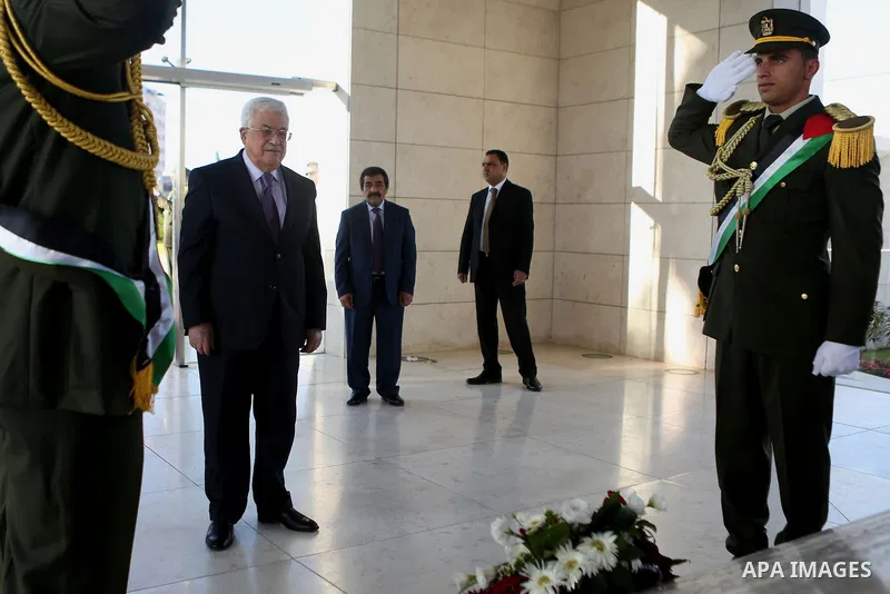 Palestinian President Mahmoud Abbas lays a wreath on the grave of late Palestinian leader Yasser Arafat on the first day of Eid al-Adha, or feast of the sacrifice, in the West Bank city of Ramallah, on Sep. 12, 2016. Mus...