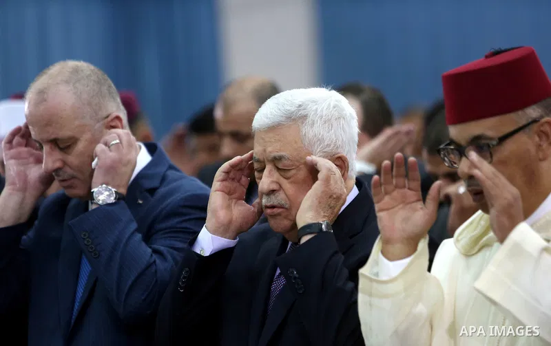 Palestinian president Mahmoud Abbas attends pray to mark the first day of Eid al-Adha, or feast of the sacrifice, at his headquarter in the West Bank city of Ramallah, on Sep. 12, 2016. Muslims around the world are celeb...