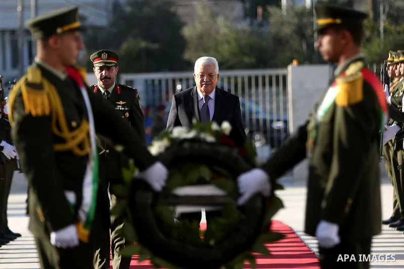 Palestinian President Mahmoud Abbas lays a wreath on the grave of late Palestinian leader Yasser Arafat on the first day of Eid al-Adha, or feast of the sacrifice, in the West Bank city of Ramallah, on Sep. 12, 2016. Mus...