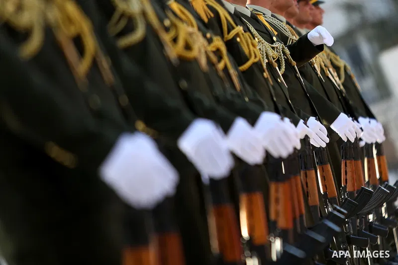 Palestinian honor guards take position before Palestinian President Mahmoud Abbas arrives to lay a wreath on the grave of late Palestinian leader Yasser Arafat on the first day of Eid al-Adha, or feast of the sacrifice,...