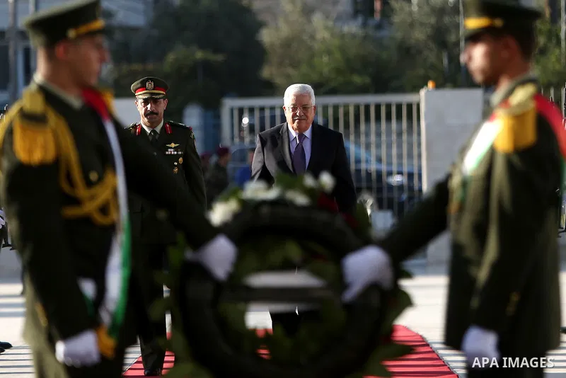 Palestinian President Mahmoud Abbas lays a wreath on the grave of late Palestinian leader Yasser Arafat on the first day of Eid al-Adha, or feast of the sacrifice, in the West Bank city of Ramallah, on Sep. 12, 2016. Mus...