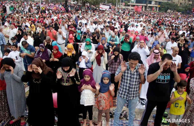 Muslim Egyptians perform the morning prayer of the Eid al-Adha holiday at Mustafa Mahmoud Square in the capital Cairo on September 12, 2016. Muslims across the world celebrate the annual festival of Eid al-Adha, or the f...