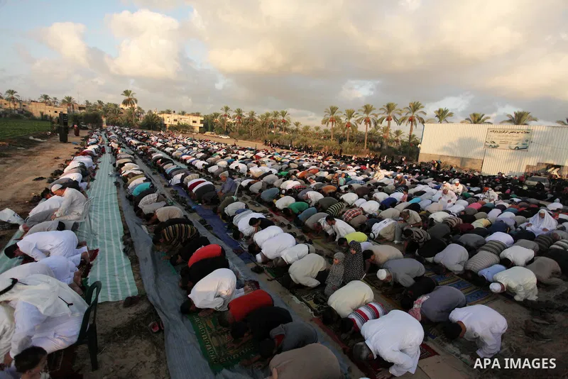 Palestinians attend the morning prayer of the Muslim holiday of the Eid al-Adha on September 12, 2016, in Khan Younis in the southern Gaza strip. Muslims across the world celebrate the annual festival of Eid al-Adha, or...