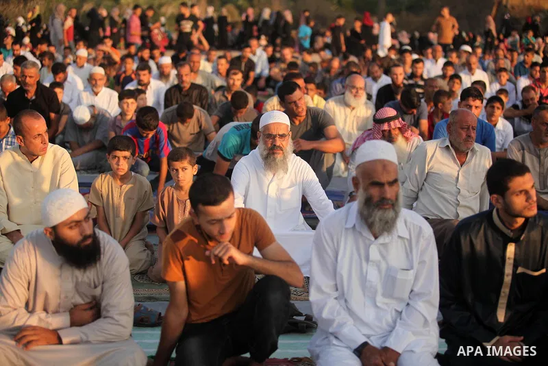 Palestinians attend the morning prayer of the Muslim holiday of the Eid al-Adha on September 12, 2016, in Khan Younis in the southern Gaza strip. Muslims across the world celebrate the annual festival of Eid al-Adha, or...