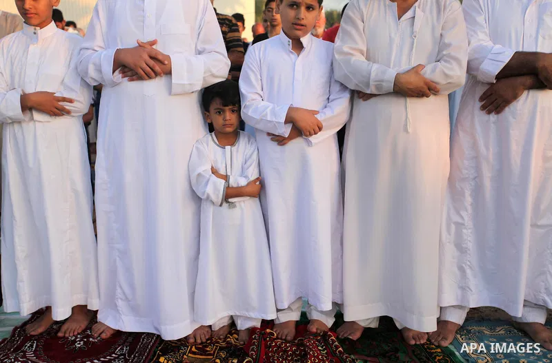 Palestinians attend the morning prayer of the Muslim holiday of the Eid al-Adha on September 12, 2016, in Khan Younis in the southern Gaza strip. Muslims across the world celebrate the annual festival of Eid al-Adha, or...