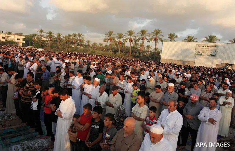 Palestinians attend the morning prayer of the Muslim holiday of the Eid al-Adha on September 12, 2016, in Khan Younis in the southern Gaza strip. Muslims across the world celebrate the annual festival of Eid al-Adha, or...