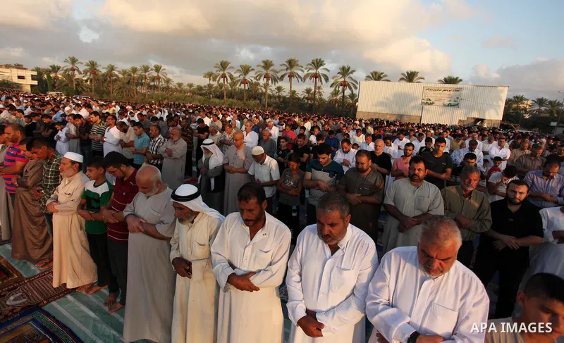 Palestinians attend the morning prayer of the Muslim holiday of the Eid al-Adha on September 12, 2016, in Khan Younis in the southern Gaza strip. Muslims across the world celebrate the annual festival of Eid al-Adha, or...