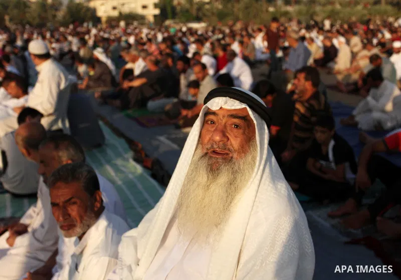 Palestinians attend the morning prayer of the Muslim holiday of the Eid al-Adha on September 12, 2016, in Khan Younis in the southern Gaza strip. Muslims across the world celebrate the annual festival of Eid al-Adha, or...