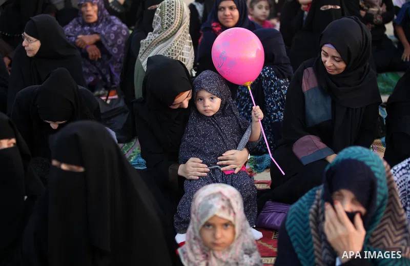 Palestinians attend the morning prayer of the Muslim holiday of the Eid al-Adha on September 12, 2016, in Khan Younis in the southern Gaza strip. Muslims across the world celebrate the annual festival of Eid al-Adha, or...