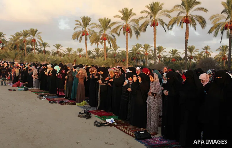 Palestinians attend the morning prayer of the Muslim holiday of the Eid al-Adha on September 12, 2016, in Khan Younis in the southern Gaza strip. Muslims across the world celebrate the annual festival of Eid al-Adha, or...