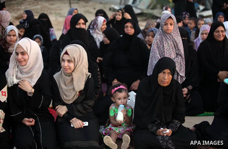 Palestinians attend the morning prayer of the Muslim holiday of the Eid al-Adha on September 12, 2016, in Khan Younis in the southern Gaza strip. Muslims across the world celebrate the annual festival of Eid al-Adha, or...
