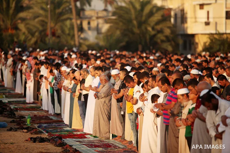 Palestinians attend the morning prayer of the Muslim holiday of the Eid al-Adha on September 12, 2016, in Khan Younis in the southern Gaza strip. Muslims across the world celebrate the annual festival of Eid al-Adha, or...
