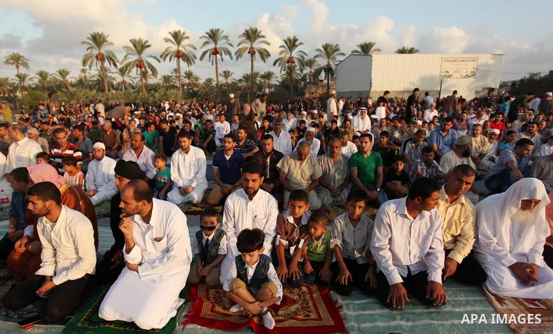 Palestinians attend the morning prayer of the Muslim holiday of the Eid al-Adha on September 12, 2016, in Khan Younis in the southern Gaza strip. Muslims across the world celebrate the annual festival of Eid al-Adha, or...