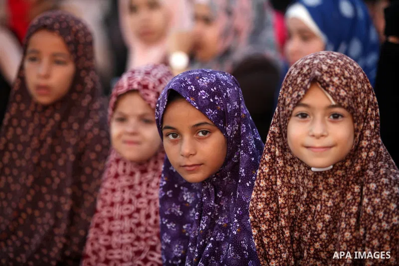 Palestinian girls attend the morning prayer of the Muslim holiday of the Eid al-Adha on September 12, 2016, in Khan Younis in the southern Gaza strip. Muslims across the world celebrate the annual festival of Eid al-Adha...