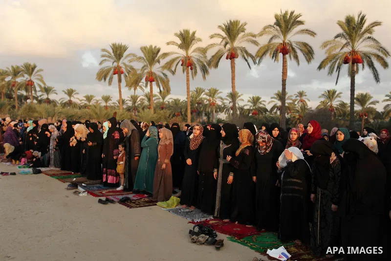 Palestinians attend the morning prayer of the Muslim holiday of the Eid al-Adha on September 12, 2016, in Khan Younis in the southern Gaza strip. Muslims across the world celebrate the annual festival of Eid al-Adha, or...