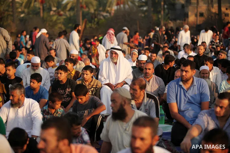 Palestinians attend the morning prayer of the Muslim holiday of the Eid al-Adha on September 12, 2016, in Khan Younis in the southern Gaza strip. Muslims across the world celebrate the annual festival of Eid al-Adha, or...