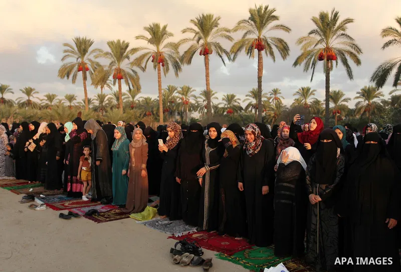 Palestinians attend the morning prayer of the Muslim holiday of the Eid al-Adha on September 12, 2016, in Khan Younis in the southern Gaza strip. Muslims across the world celebrate the annual festival of Eid al-Adha, or...