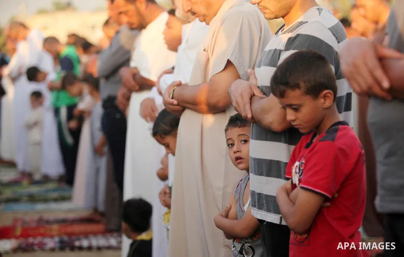 Palestinians attend the morning prayer of the Muslim holiday of the Eid al-Adha on September 12, 2016, in Khan Younis in the southern Gaza strip. Muslims across the world celebrate the annual festival of Eid al-Adha, or...