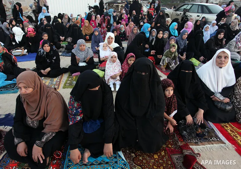 Palestinians attend the morning prayer of the Muslim holiday of the Eid al-Adha on September 12, 2016, in Khan Younis in the southern Gaza strip. Muslims across the world celebrate the annual festival of Eid al-Adha, or...