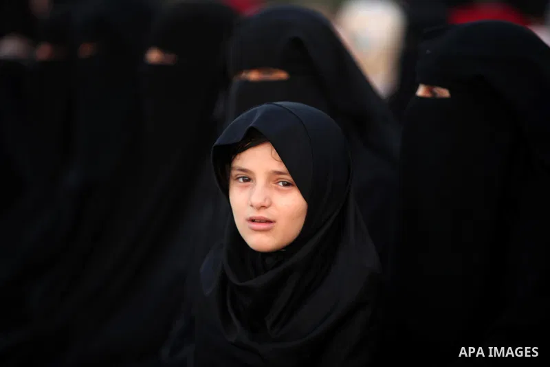 A Palestinian girl attends the morning prayer of the Muslim holiday of the Eid al-Adha on September 12, 2016, in Khan Younis in the southern Gaza strip. Muslims across the world celebrate the annual festival of Eid al-Ad...
