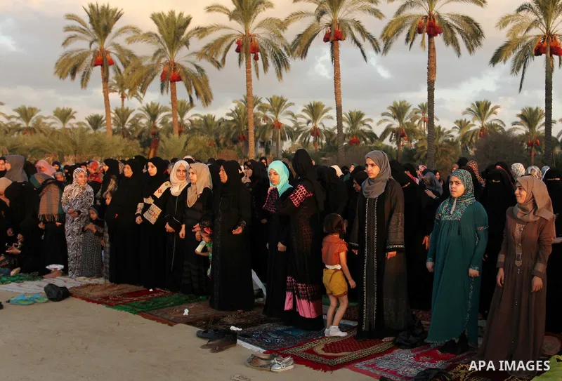 Palestinians attend the morning prayer of the Muslim holiday of the Eid al-Adha on September 12, 2016, in Khan Younis in the southern Gaza strip. Muslims across the world celebrate the annual festival of Eid al-Adha, or...