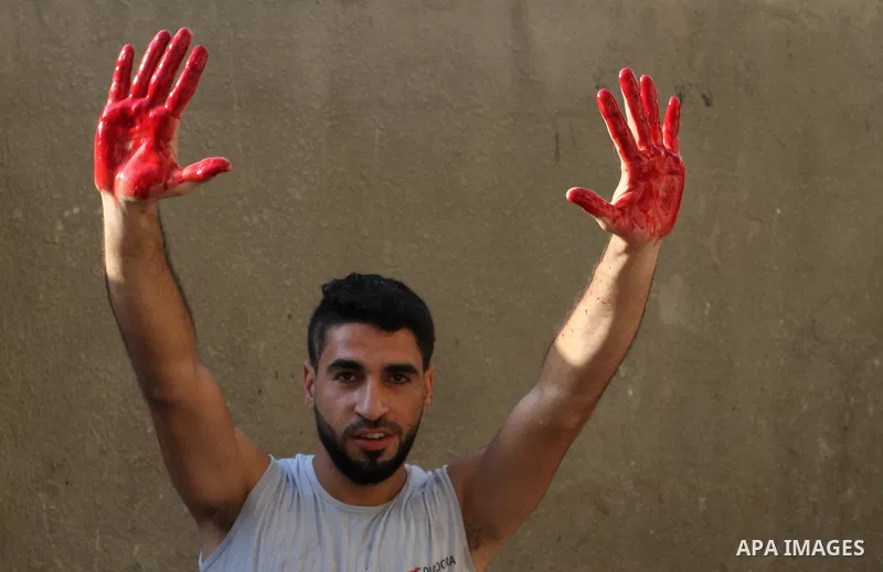 Palestinian Muslims sacrifice animals on the first day of of Eid al-Adha or the feast of sacrifice, in Rafah in the southern Gaza Strip on September 12, 2016. Muslims across the world are celebrating the annual festival...