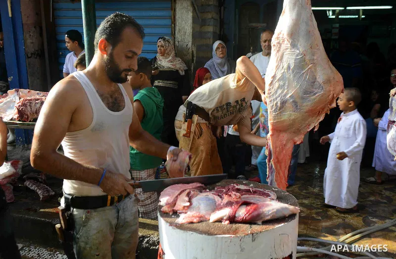 Egyptian Muslims sacrifice animals on the first day of of Eid al-Adha or the feast of sacrifice, in Cairo, Egypt, on September 12, 2016. Muslims across the world are celebrating the annual festival of Eid al-Adha, or the...