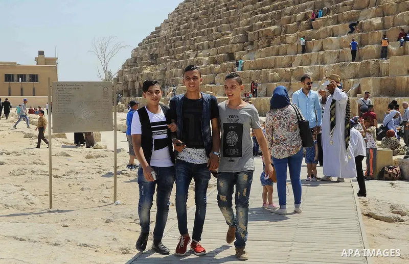Egyptians visit the Great Giza pyramids on the first day of the Eid al-Adha holiday, in Cairo, Egypt, on September 12, 2016. Muslims across the world celebrate the annual festival of Eid al-Adha, or the festival of sacri...