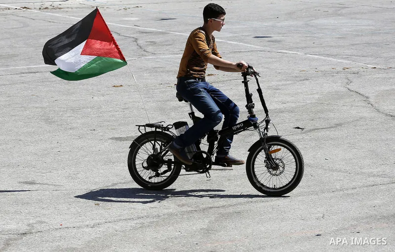 Palestinians enjoy the second day of Eid al-Adha or the feast of sacrifice, in the West Bank city of Hebron, on Sep. 13, 2016. Muslims across the world are celebrating the annual festival of Eid al-Adha, or the Festival...