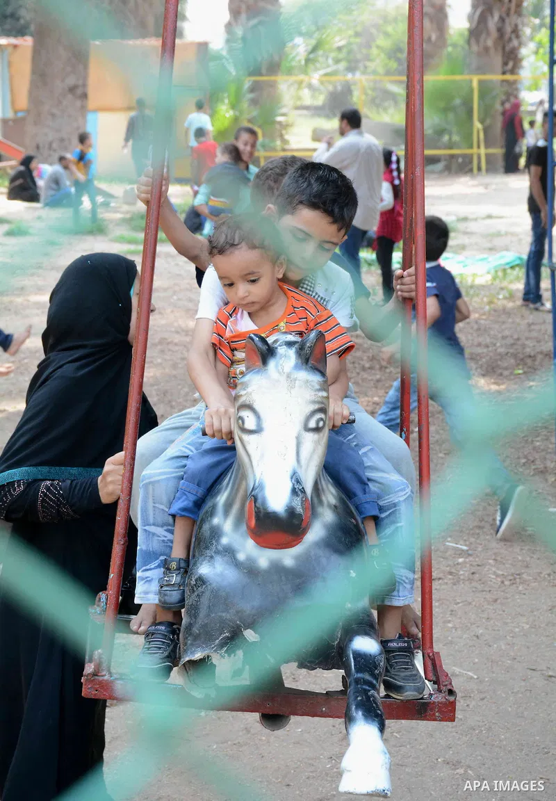Egyptian enjoy the second day of Eid al-Adha or the feast of sacrifice, at a park in cairo, on Sep. 13, 2016. Muslims across the world are celebrating the annual festival of Eid al-Adha, or the Festival of Sacrifice, whi...