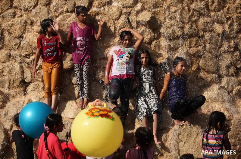 Palestinian children play at an amusement park on the third day of Eid al-Adha or the feast of sacrifice in Gaza city, on Sep. 14, 2016. Muslims across the world are celebrating the annual festival of Eid al-Adha, or the...