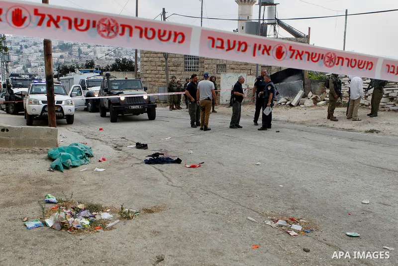 Israeli security forces gather at the scene of a stabbing attack, where a Palestinian stabbed an Israeli soldier before he was shot dead, in the flashpoint West Bank city of Hebron on September 17, 2016. An Israeli milit...