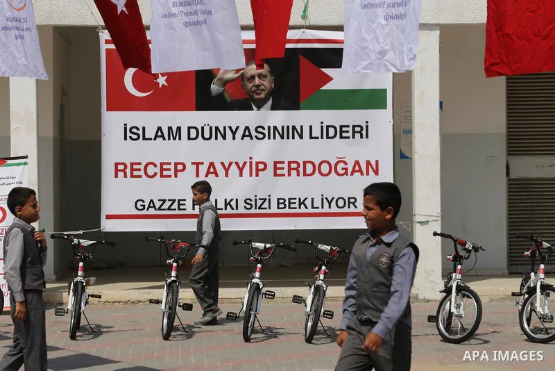 Palestinian orphan student receive bicycles from Turkish aid "clips", in Gaza City, on Sept. 17, 2016. Photo by Mohammed Asad