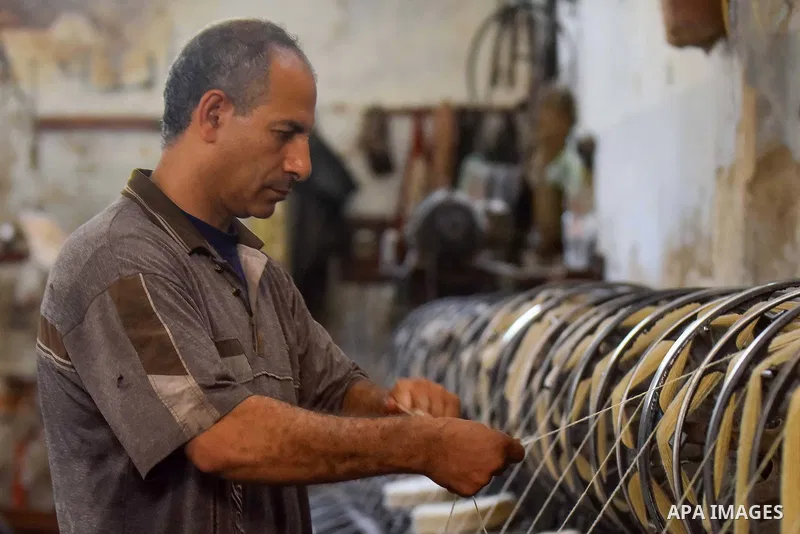 A worker prepares wool for production in a factory in Beheira Governorate, Egypt on September 3, 2016. Photo by Amr Sayed