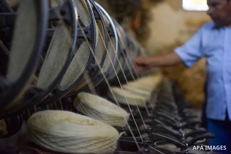 A worker prepares wool for production in a factory in Beheira Governorate, Egypt on September 3, 2016. Photo by Amr Sayed