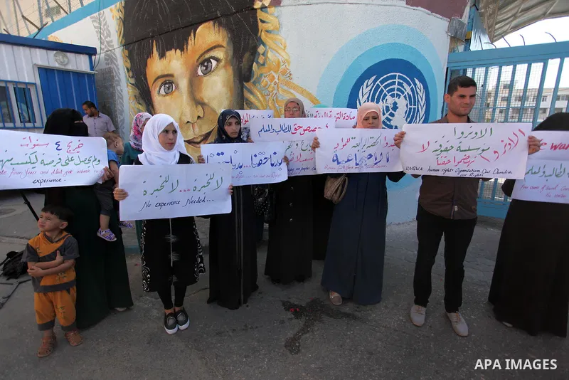 Palestinian teachers and graduates take part a protest demanding their rights in front of the headquarters United Nations Relief and Works Agency (UNRWA), in Gaza City, on Sept. 18, 2016. Photo by Ashraf Amra