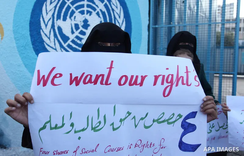 Palestinian teachers and graduates take part a protest demanding their rights in front of the headquarters United Nations Relief and Works Agency (UNRWA), in Gaza City, on Sept. 18, 2016. Photo by Ashraf Amra