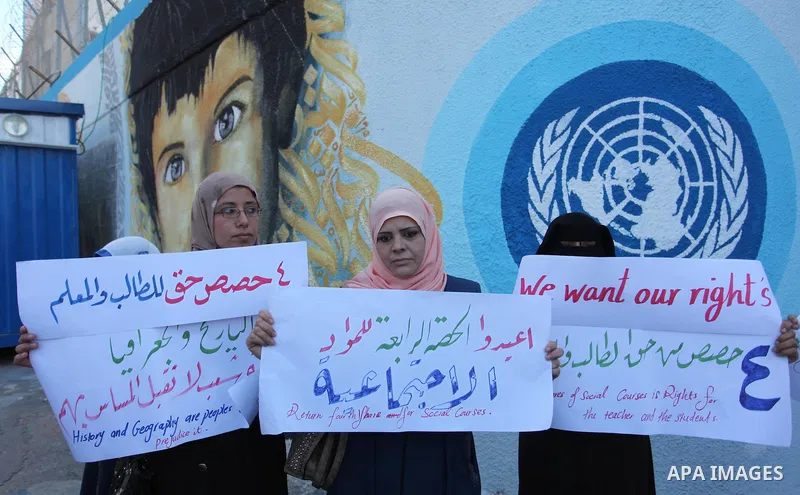 Palestinian teachers and graduates take part a protest demanding their rights in front of the headquarters United Nations Relief and Works Agency (UNRWA), in Gaza City, on Sept. 18, 2016. Photo by Ashraf Amra