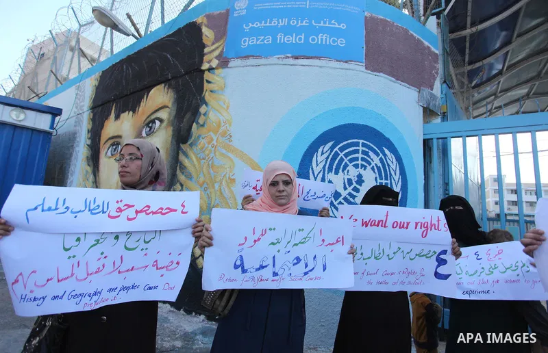 Palestinian teachers and graduates take part a protest demanding their rights in front of the headquarters United Nations Relief and Works Agency (UNRWA), in Gaza City, on Sept. 18, 2016. Photo by Ashraf Amra