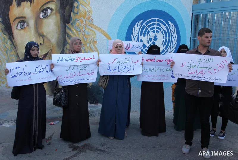 Palestinian teachers and graduates take part a protest demanding their rights in front of the headquarters United Nations Relief and Works Agency (UNRWA), in Gaza City, on Sept. 18, 2016. Photo by Ashraf Amra