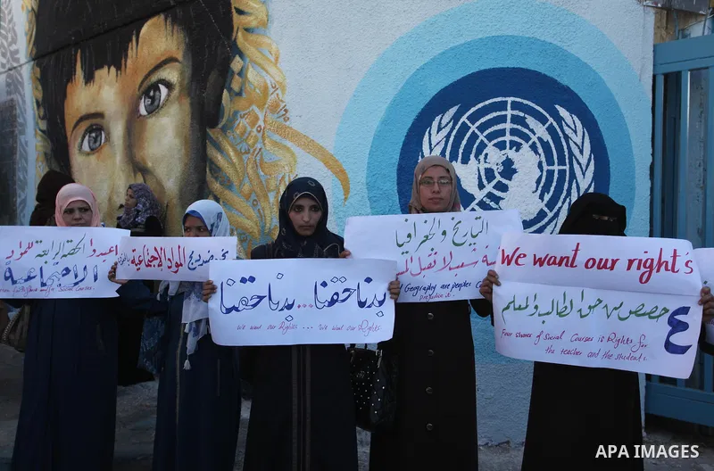 Palestinian teachers and graduates take part a protest demanding their rights in front of the headquarters United Nations Relief and Works Agency (UNRWA), in Gaza City, on Sept. 18, 2016. Photo by Ashraf Amra