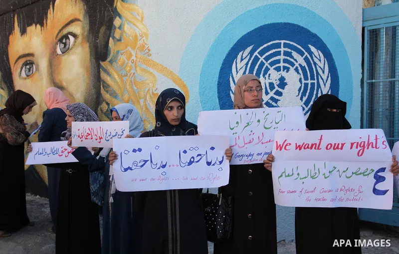 Palestinian teachers and graduates take part a protest demanding their rights in front of the headquarters United Nations Relief and Works Agency (UNRWA), in Gaza City, on Sept. 18, 2016. Photo by Ashraf Amra