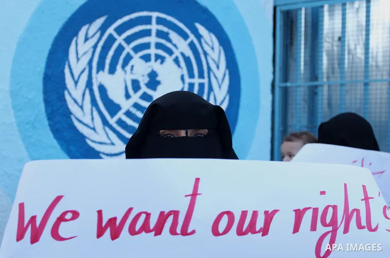 Palestinian teachers and graduates take part a protest demanding their rights in front of the headquarters United Nations Relief and Works Agency (UNRWA), in Gaza City, on Sept. 18, 2016. Photo by Ashraf Amra